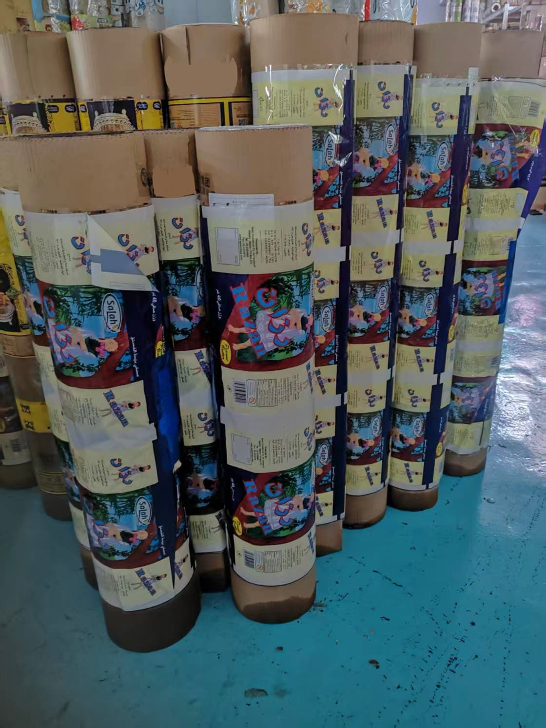 Stacks of printed rolls standing on their cores.