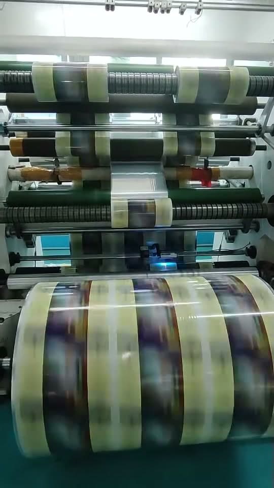 Freshly slit rolls turning on a rewinder.